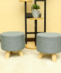 Elevate your living space with our Set of 2 Round Wooden Fabric Footstools - perfect for resting your feet in style! Shop now for cozy elegance.