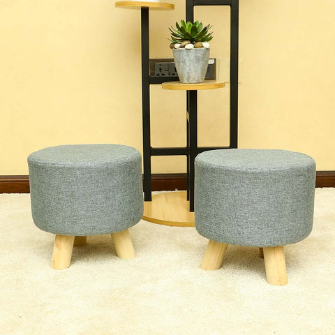 Elevate your living space with our Set of 2 Round Wooden Fabric Footstools - perfect for resting your feet in style! Shop now for cozy elegance.