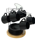 12-Piece Porcelain Coffee & Tea Set with metal stand featuring black coffee mugs and saucers displayed on a floor chair.